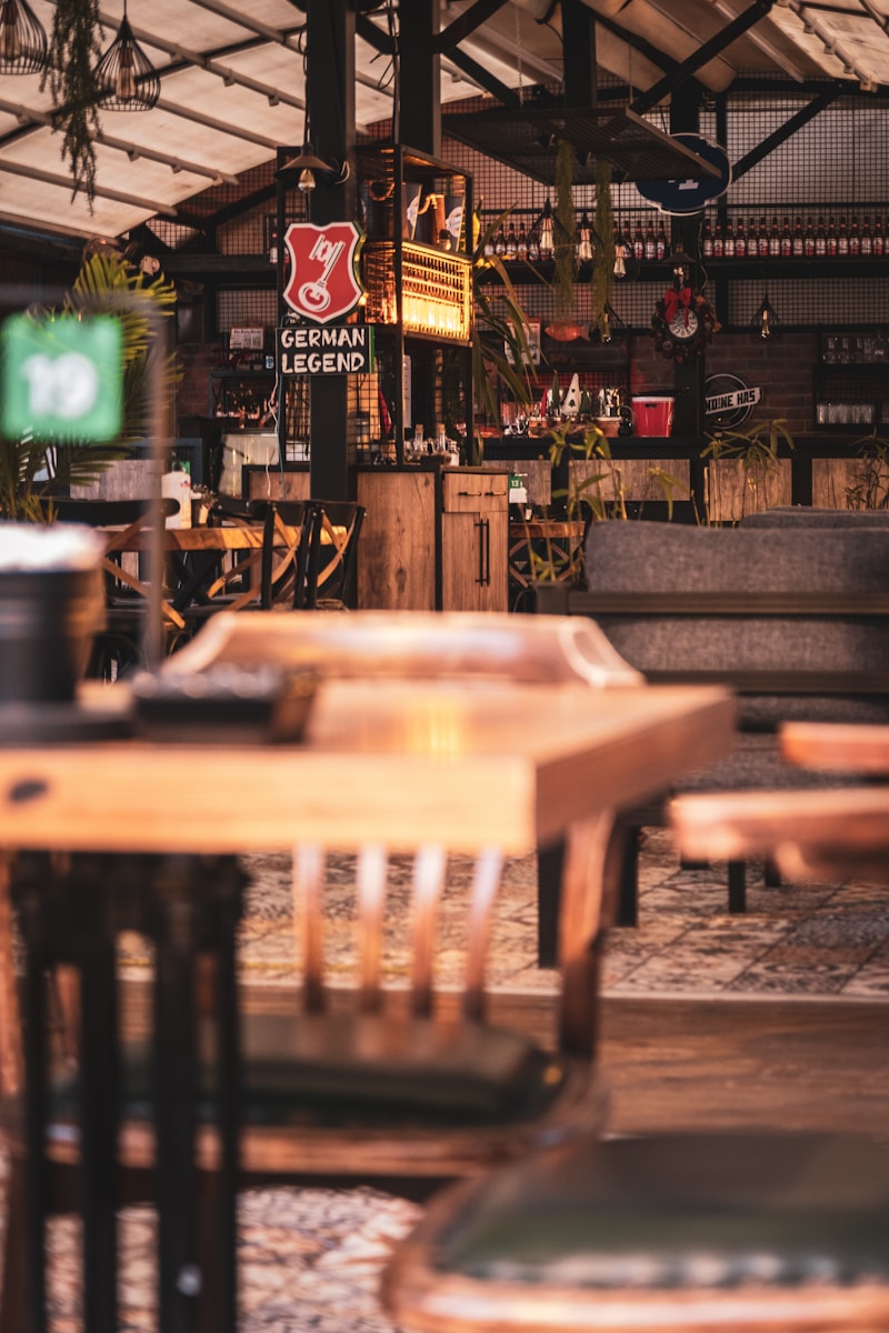 the inside of a restaurant with tables and chairs